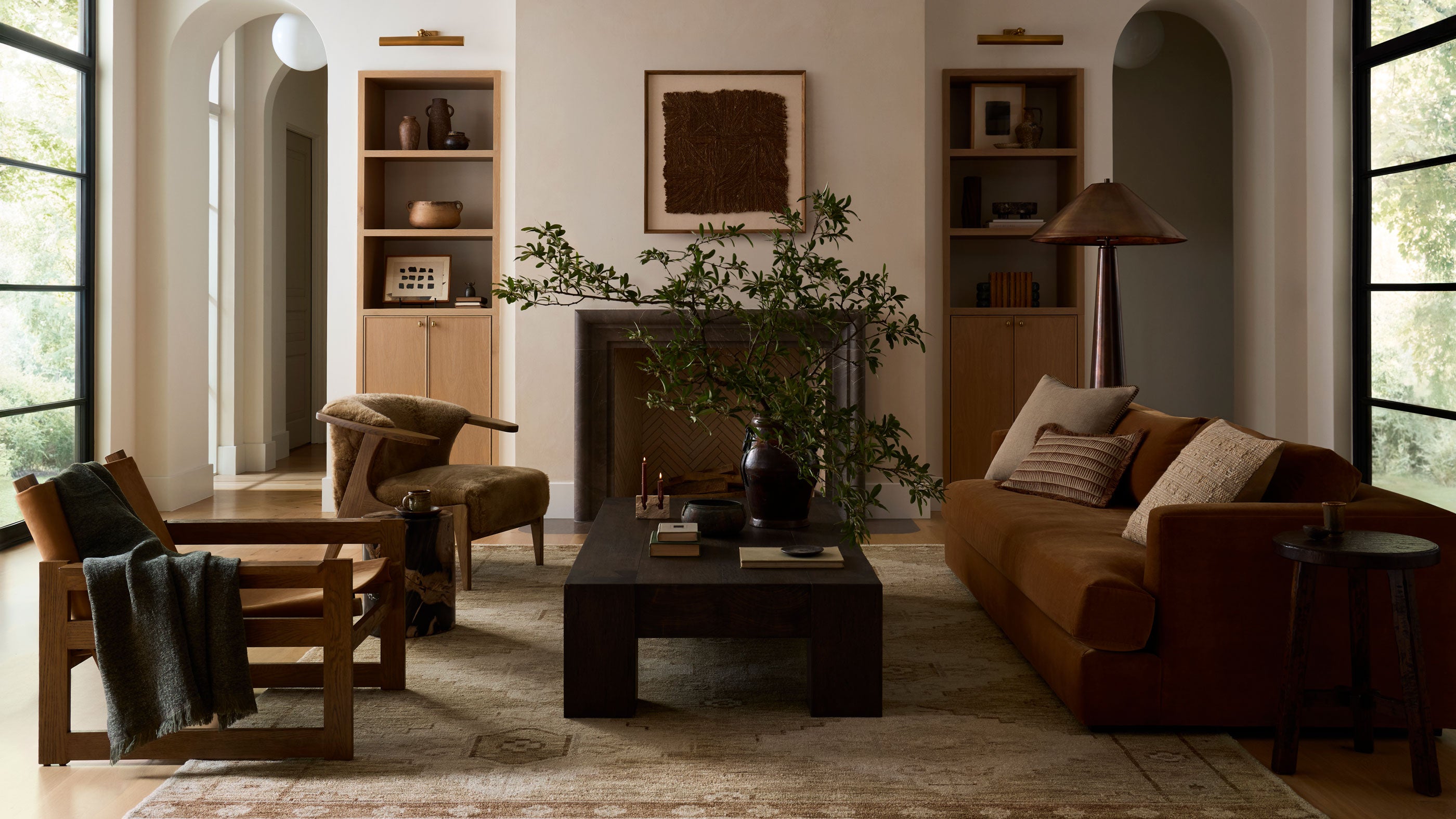 Framed loloi rugs and textiles hanging on wall