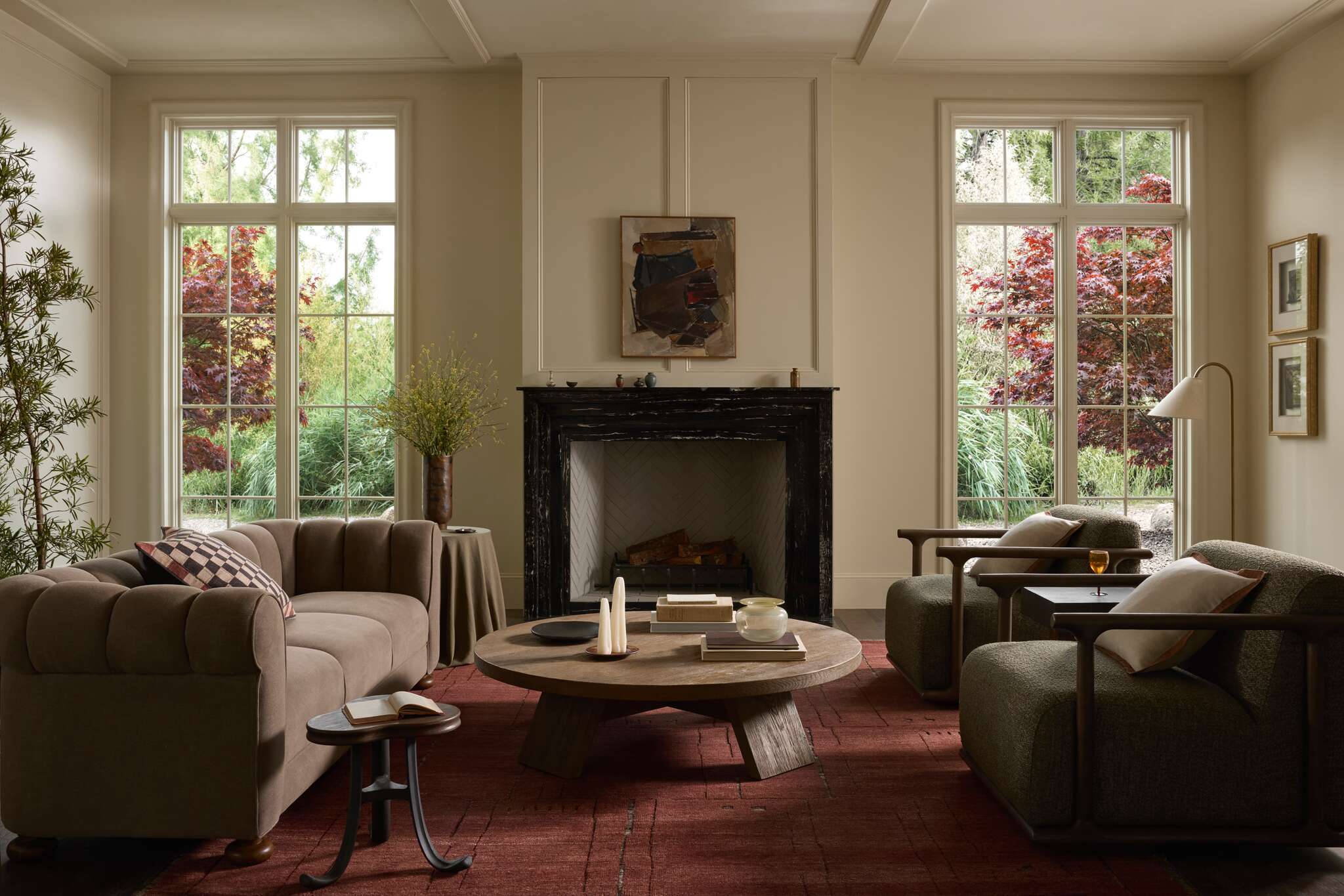 Framed loloi rugs and textiles hanging on wall